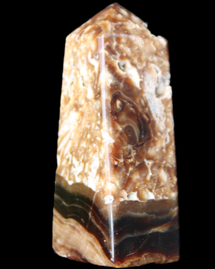 Chocolate Calcite obelisk with caves 95*40mm 217g in UV light - Rocks and Things Store