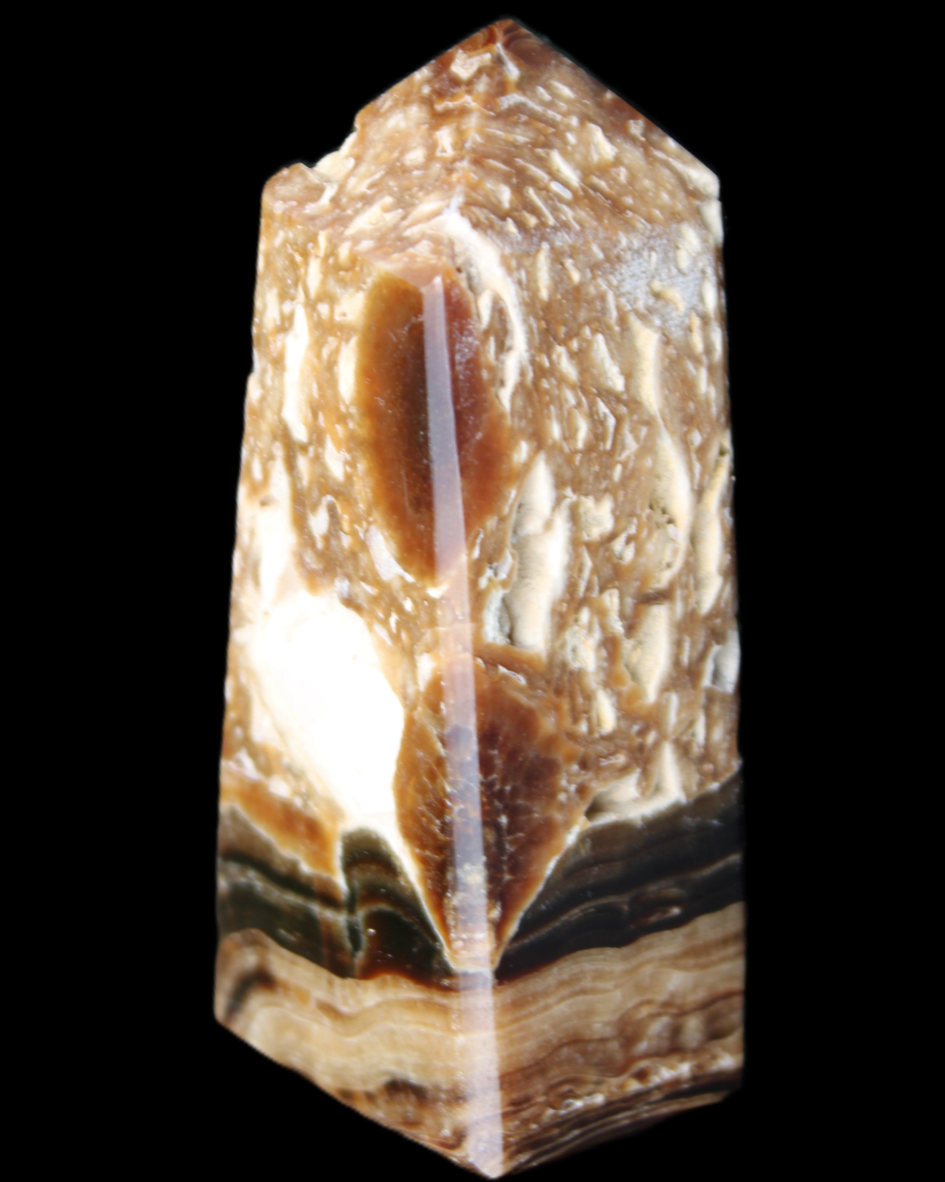 Chocolate Calcite obelisk with caves 95*40mm 217g in UV light - Rocks and Things Store