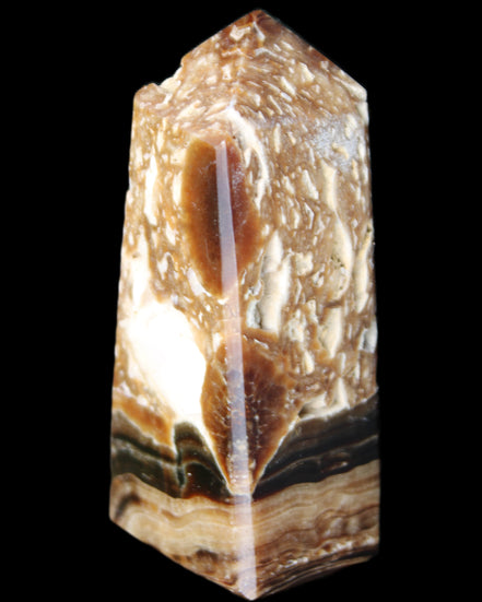 Chocolate Calcite obelisk with caves 95*40mm 217g in UV light - Rocks and Things Store