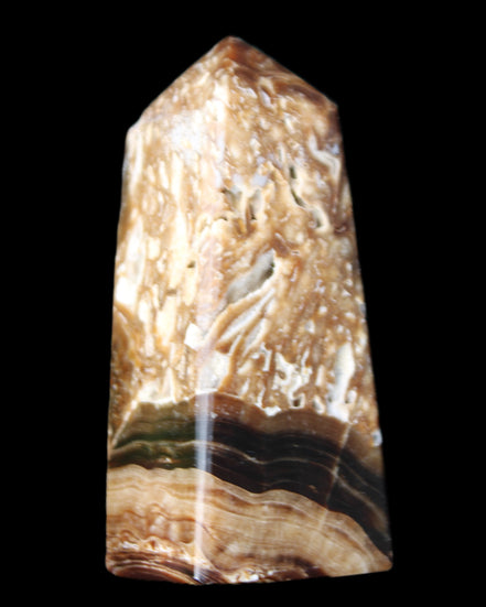 Chocolate Calcite obelisk with caves 95*40mm 217g in UV light - Rocks and Things Store