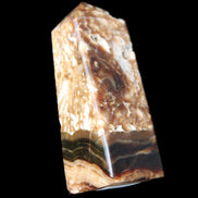 Chocolate Calcite obelisk with caves 95*40mm 217g in UV light - Rocks and Things Store