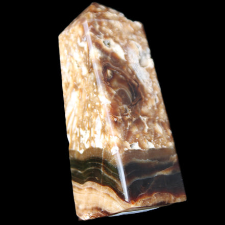 Chocolate Calcite obelisk with caves 95*40mm 217g in UV light - Rocks and Things Store