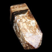 Chocolate Calcite obelisk with caves 95*40mm 217g in UV light - Rocks and Things Store