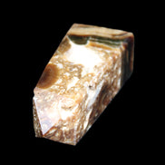 Chocolate Calcite obelisk with caves 95*40mm 217g in UV light - Rocks and Things Store