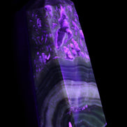 Chocolate Calcite obelisk 111*35mm 208g in UV light - Rocks and Things Store