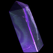 Chocolate Calcite obelisk 93*33mm 177g in UV light - Rocks and Things Store