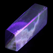 Chocolate Calcite obelisk 93*33mm 177g in UV light - Rocks and Things Store