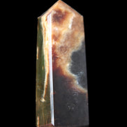 Chocolate Calcite obelisk 93*33mm 177g in UV light - Rocks and Things Store