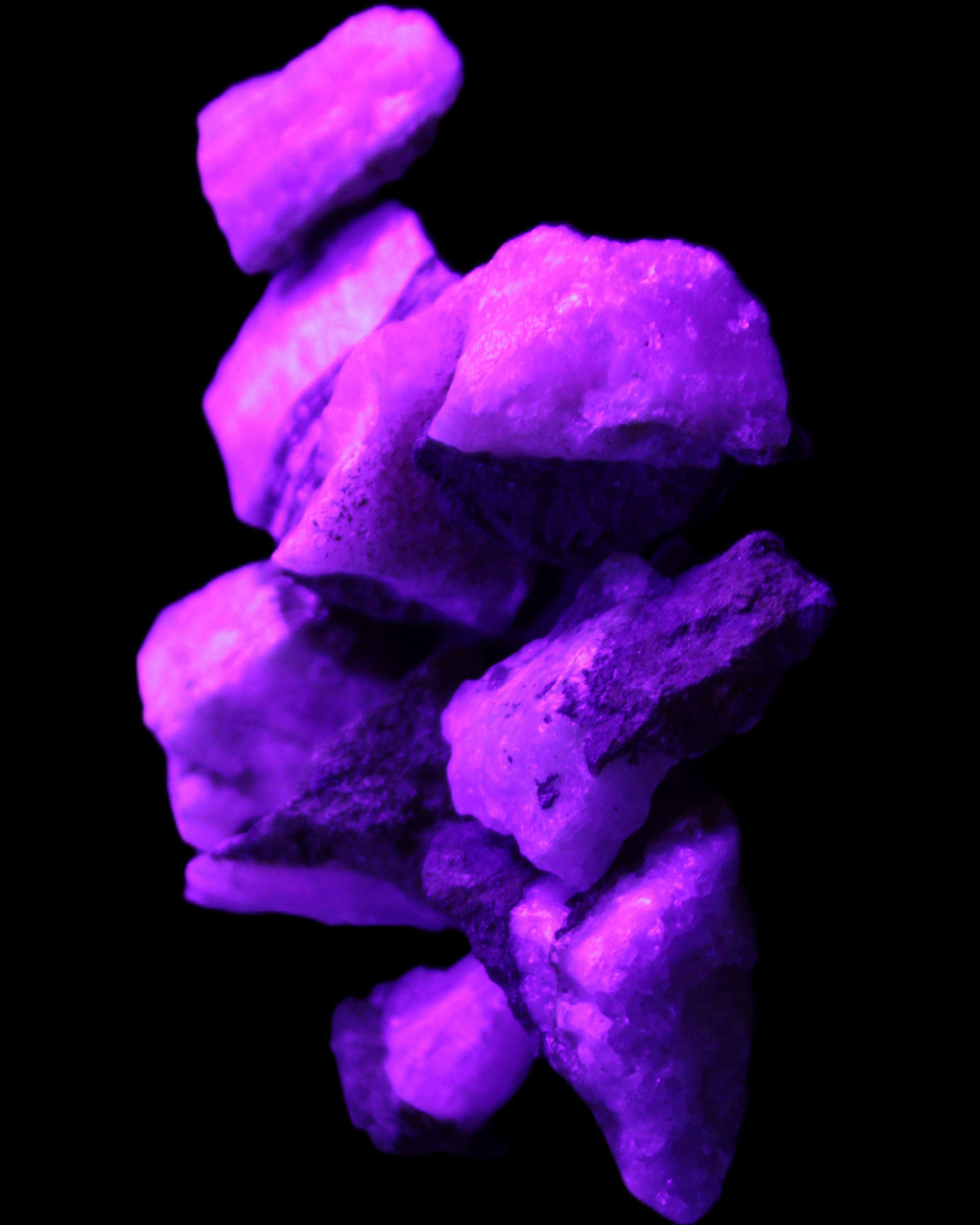 Pink Aragonite 9 small stones 23-35mm 77g in UV light - Rocks and Things Store