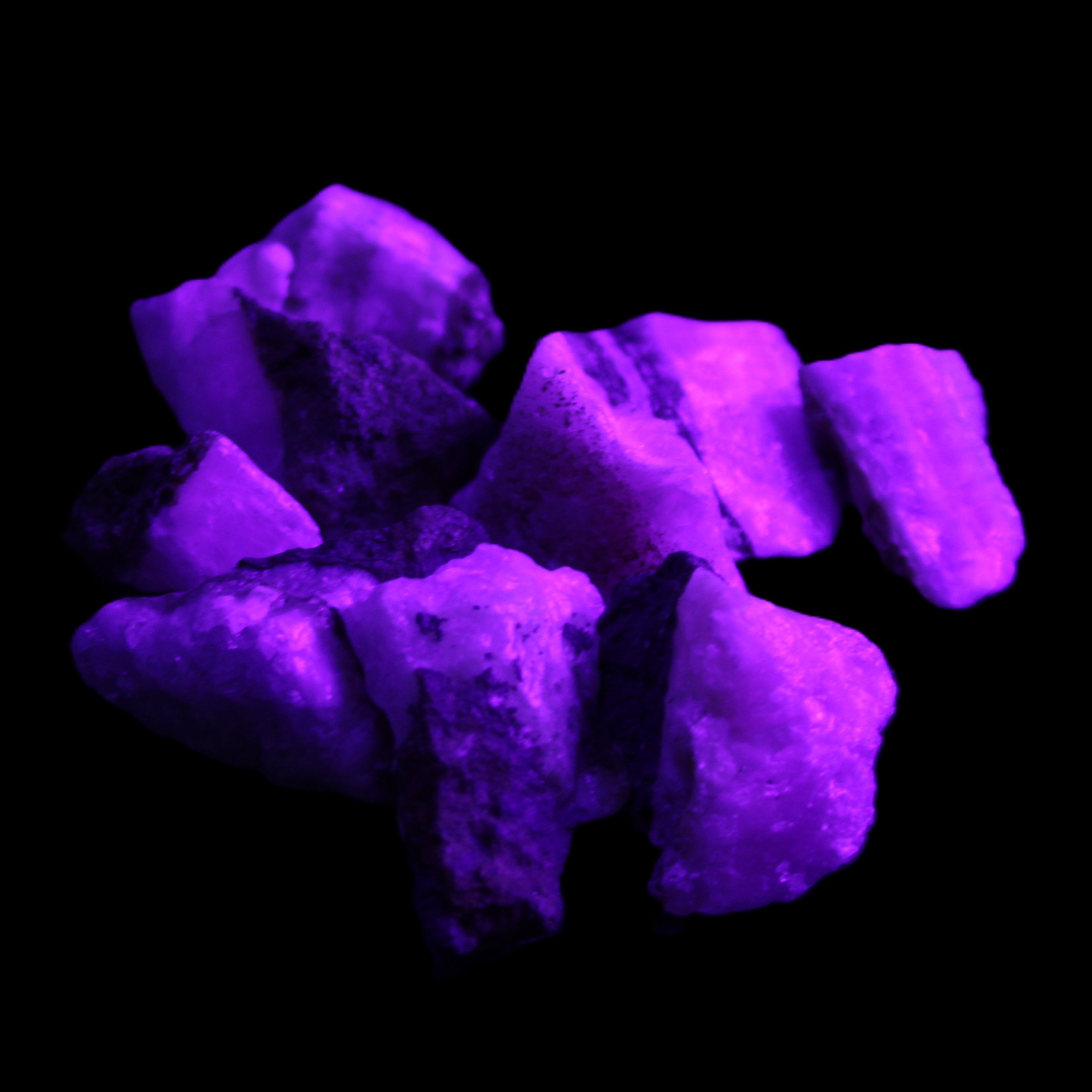 Pink Aragonite 9 small stones 23-35mm 77g in UV light - Rocks and Things Store