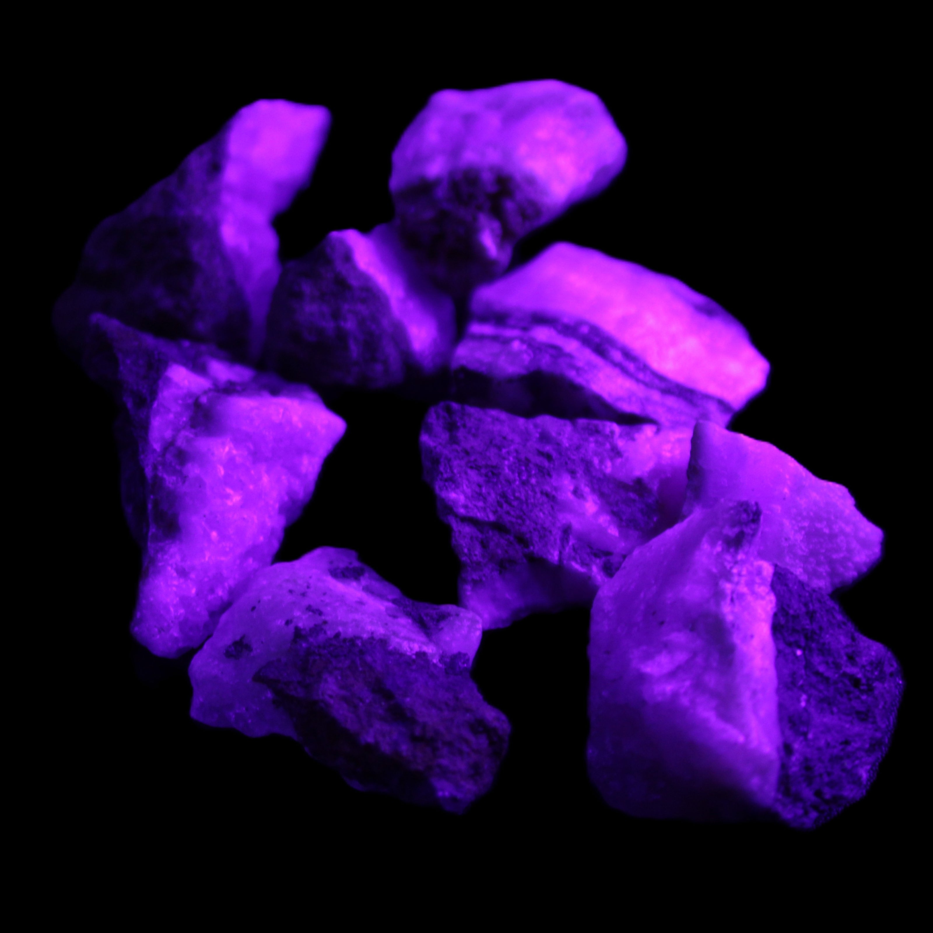 Pink Aragonite 9 small stones 23-35mm 77g in UV light - Rocks and Things Store