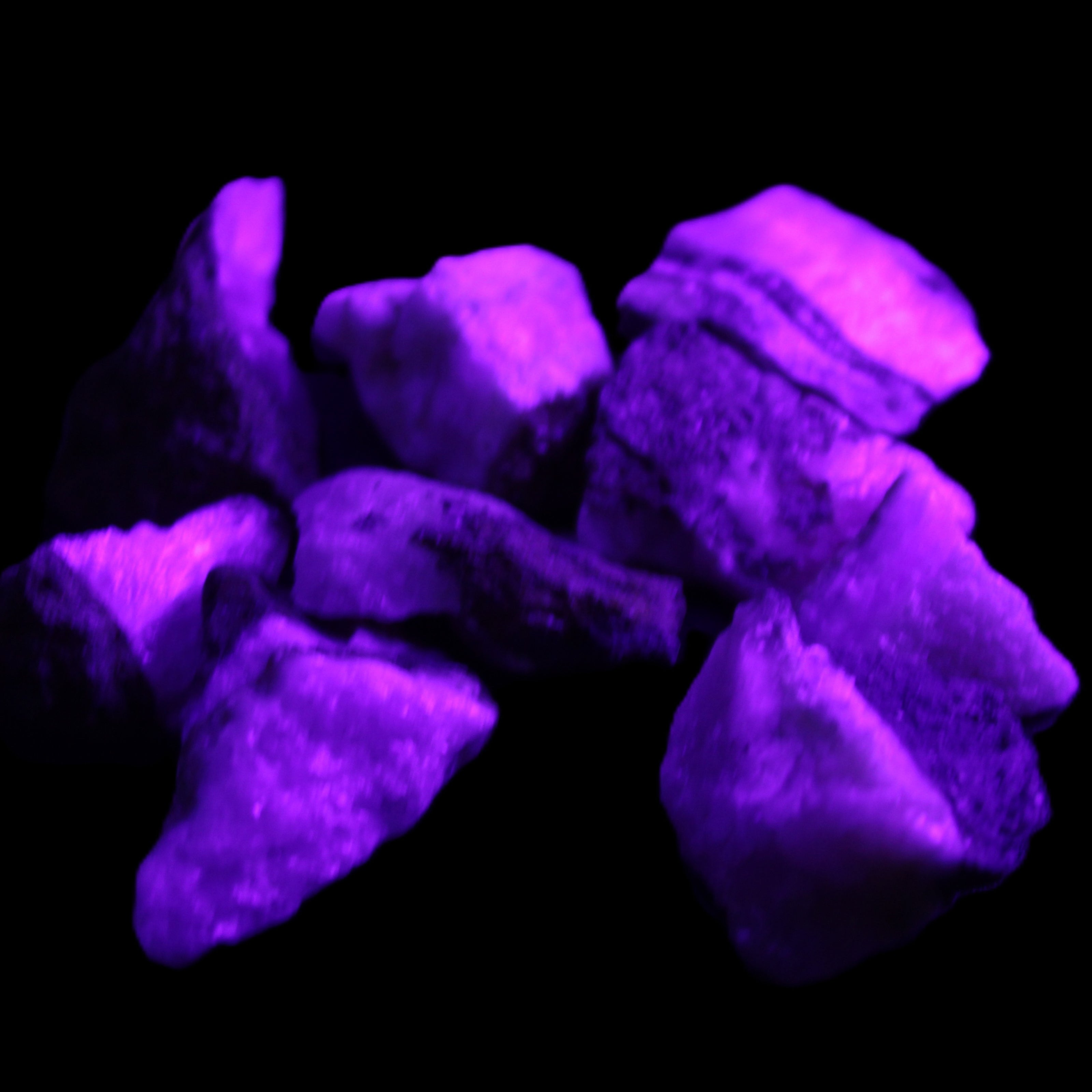 Pink Aragonite 9 small stones 23-35mm 77g in UV light - Rocks and Things Store