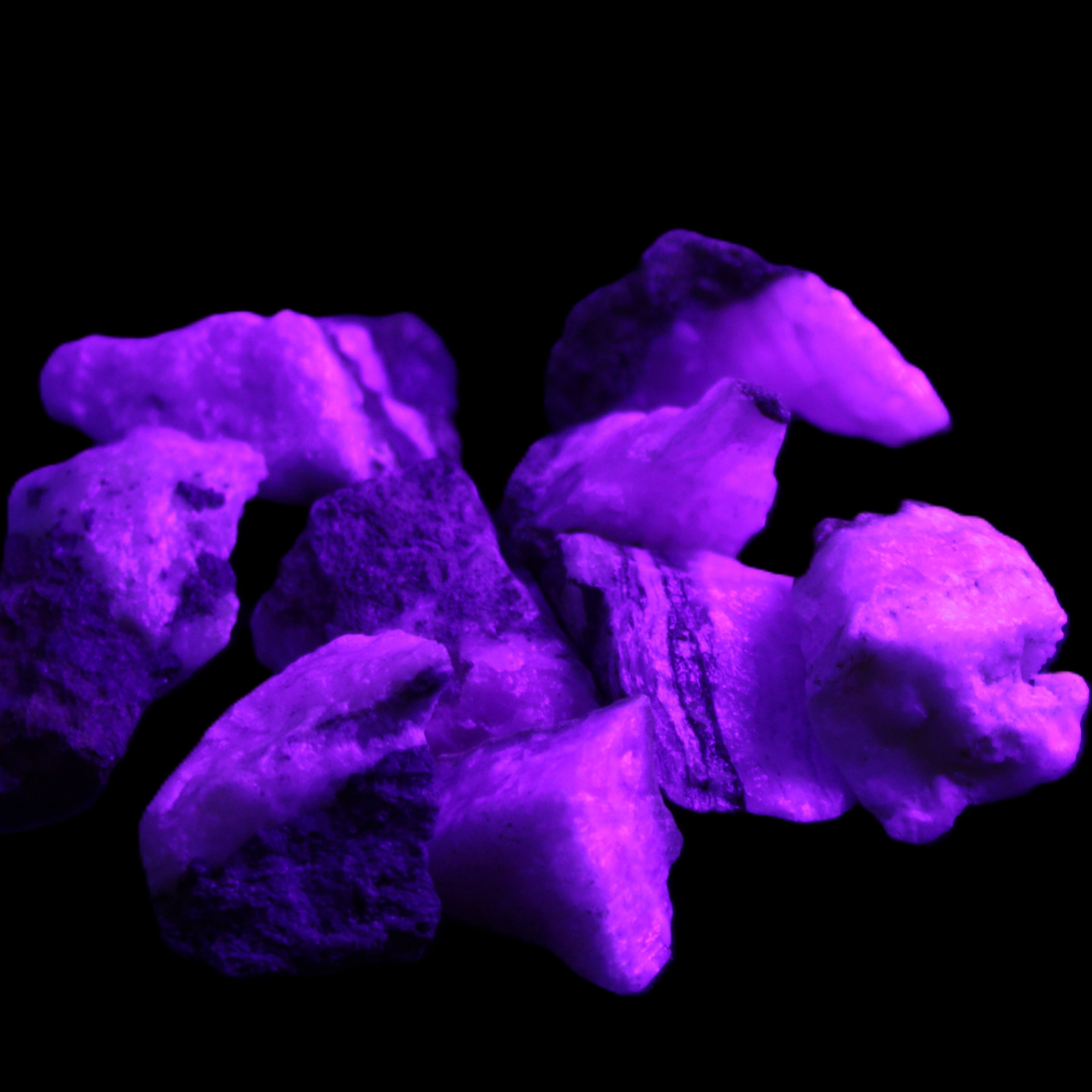 Pink Aragonite 9 small stones 23-35mm 77g in UV light - Rocks and Things Store