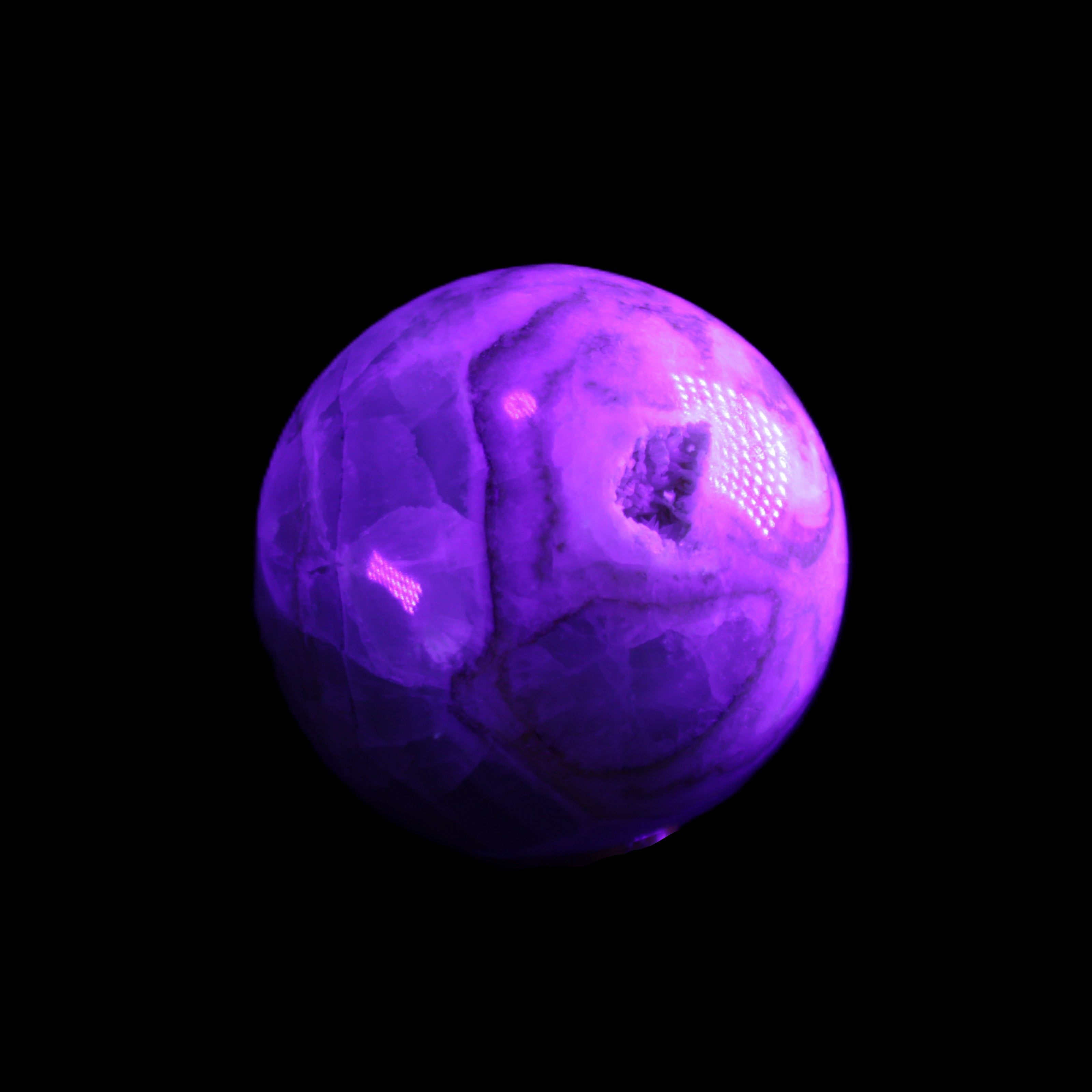 Orange, Lime & Lemon Aragonite sphere 648g in UV light - Rocks and Things Store