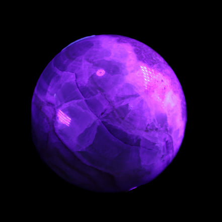 Orange, Lime & Lemon Aragonite sphere 648g in UV light - Rocks and Things Store