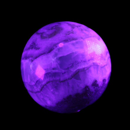 Orange, Lime & Lemon Aragonite sphere 648g in UV light - Rocks and Things Store