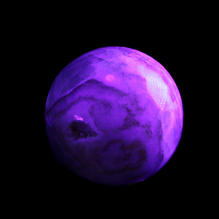 Orange, Lime & Lemon Aragonite sphere 648g in UV light - Rocks and Things Store