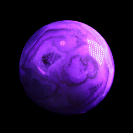 Orange, Lime & Lemon Aragonite sphere 648g in UV light - Rocks and Things Store