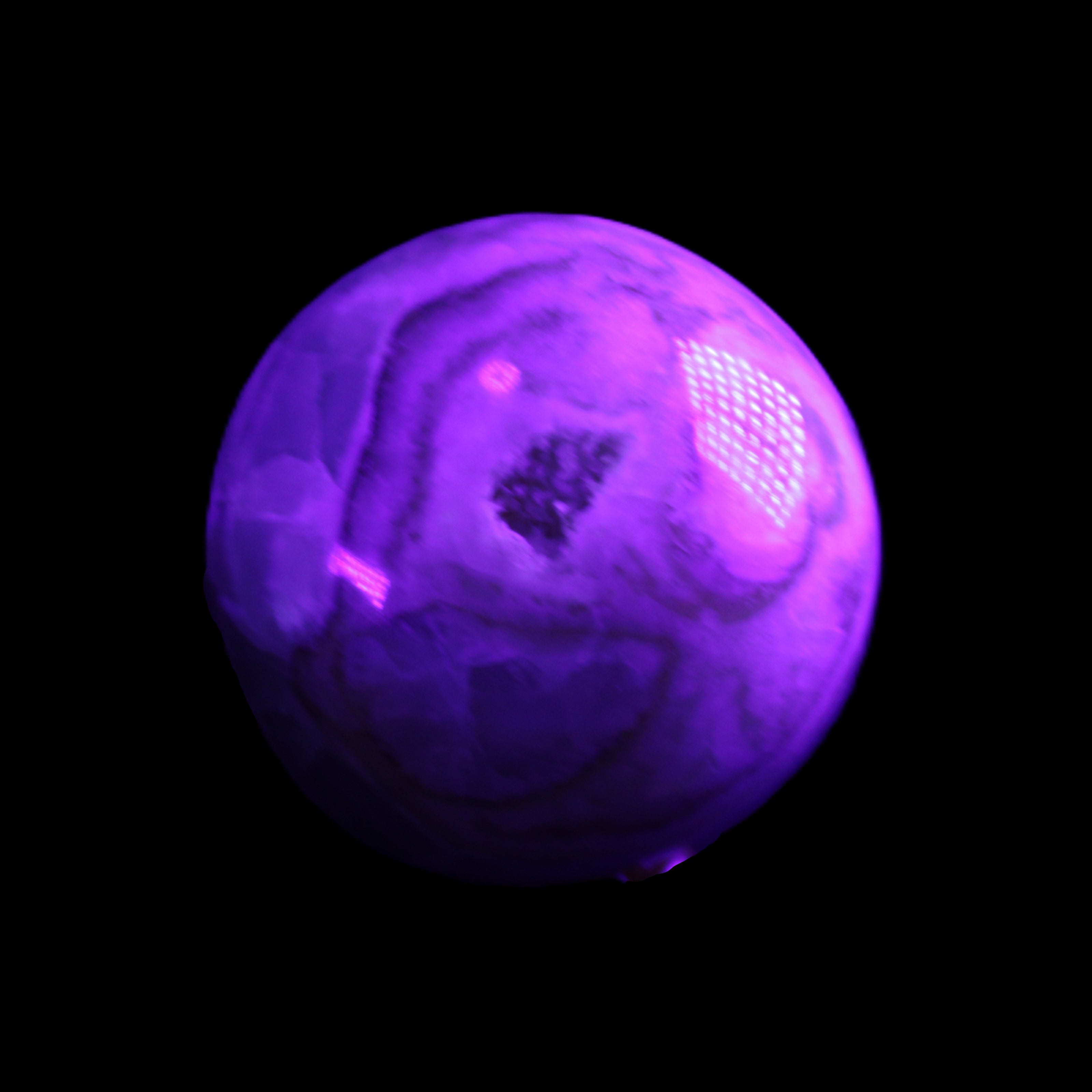 Orange, Lime & Lemon Aragonite sphere 648g in UV light - Rocks and Things Store