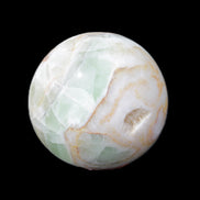 Orange, Lime and Lemon Aragonite sphere 648g in sunlight - Rocks and Things Store