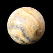 Bumblebee Calcite sphere 80g in sunlight - Rocks and Things Store