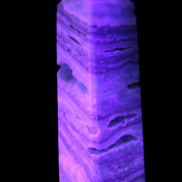Aqua Blue Caribbean Calcite obelisk 292g in UV light - Rocks and Things Store