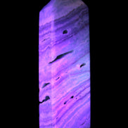 Aqua Blue Caribbean Calcite obelisk 292g in UV light - Rocks and Things Store