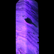 Aqua Blue Caribbean Calcite obelisk 292g in UV light - Rocks and Things Store