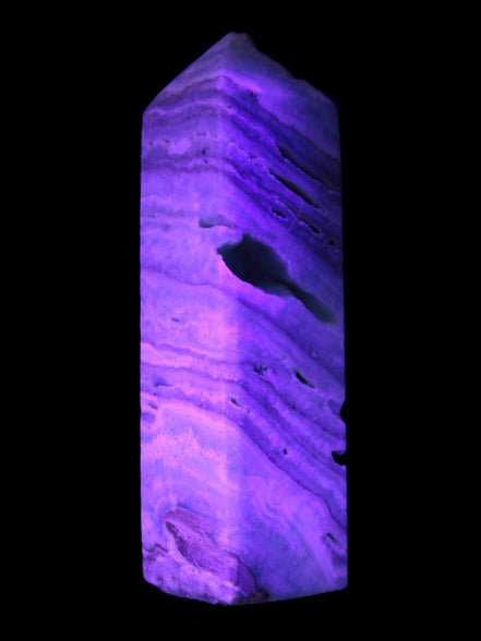 Aqua Blue Caribbean Calcite obelisk 292g in UV light - Rocks and Things Store
