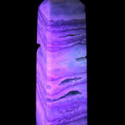 Aqua Blue Caribbean Calcite obelisk 292g in UV light - Rocks and Things Store