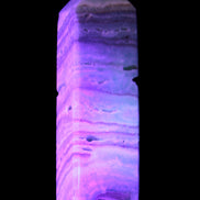 Aqua Blue Caribbean Calcite obelisk 292g in UV light - Rocks and Things Store