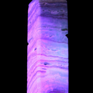 Aqua Blue Caribbean Calcite obelisk 292g in UV light - Rocks and Things Store