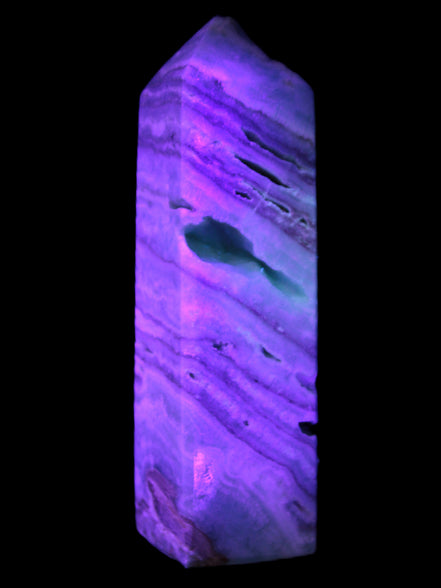 Aqua Blue Caribbean Calcite obelisk 292g in UV light - Rocks and Things Store