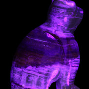 Afghan Jade hand-carved Cat 67*31*103mm 354g in UV light - Rocks and Things Store