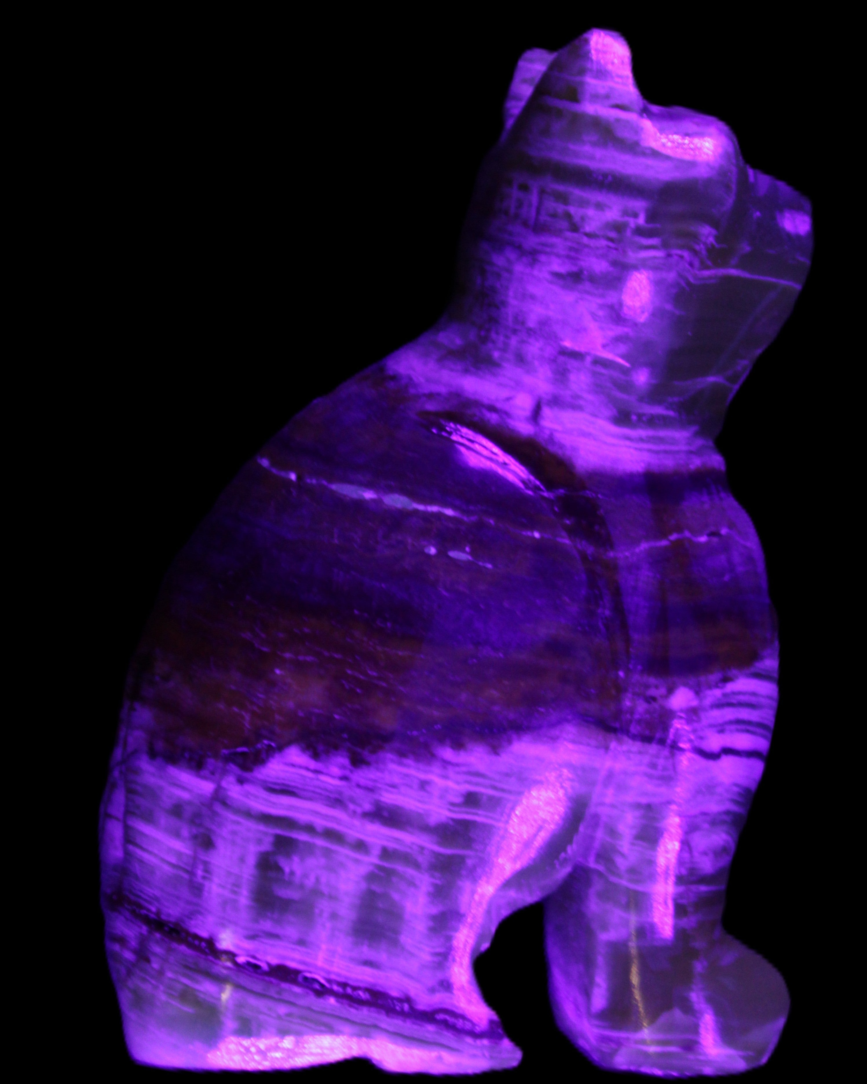 Afghan Jade hand-carved Cat 67*31*103mm 354g in UV light - Rocks and Things Store