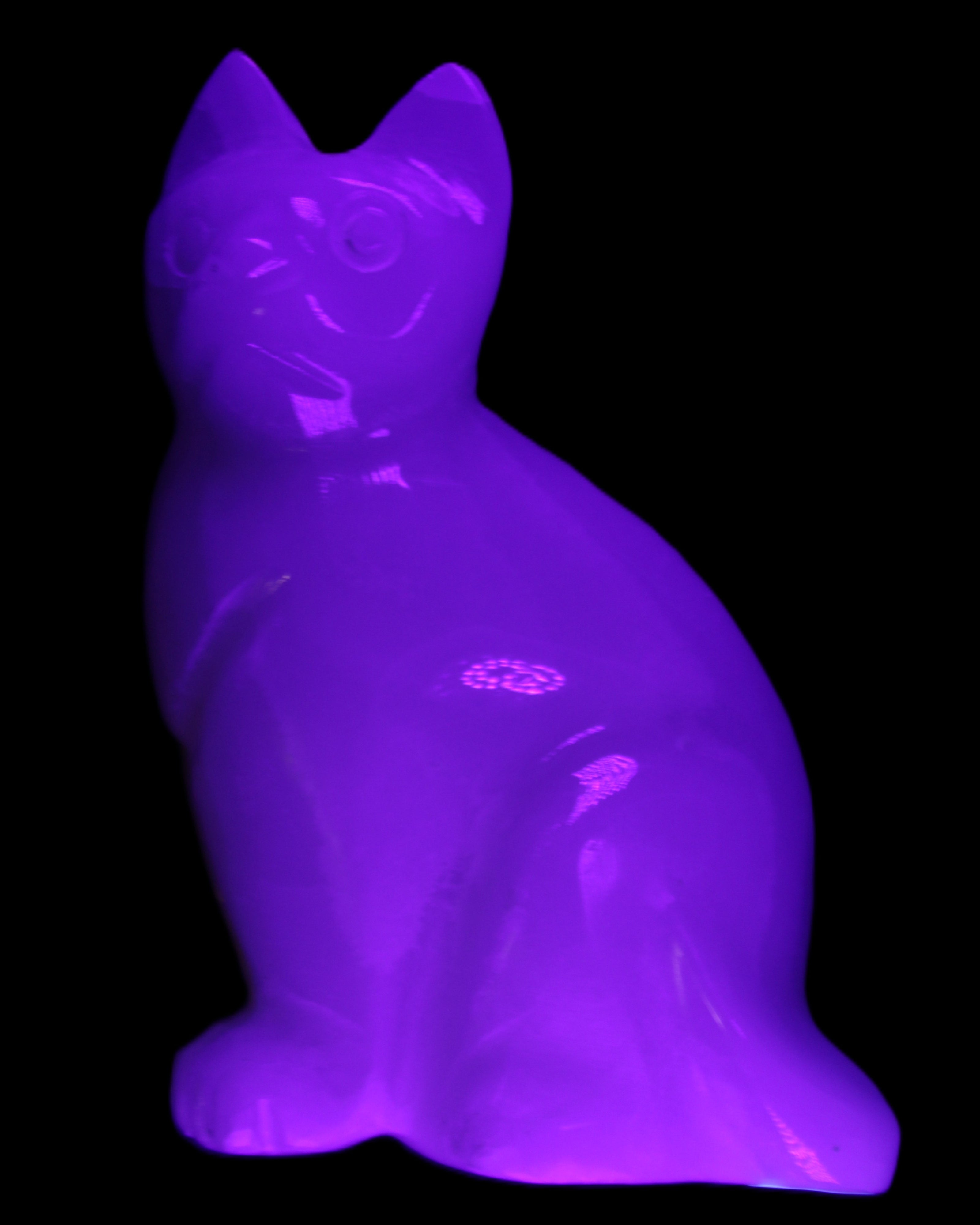 White Onyx Afghan Jade hand-carved Cat 87*48*138mm 773g in UV light - Rocks and Things Store