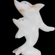 Afghan Jade hand-carved leaping Dolphin pair 78*37*105mm 256g in sunlight - Rocks and Things Store