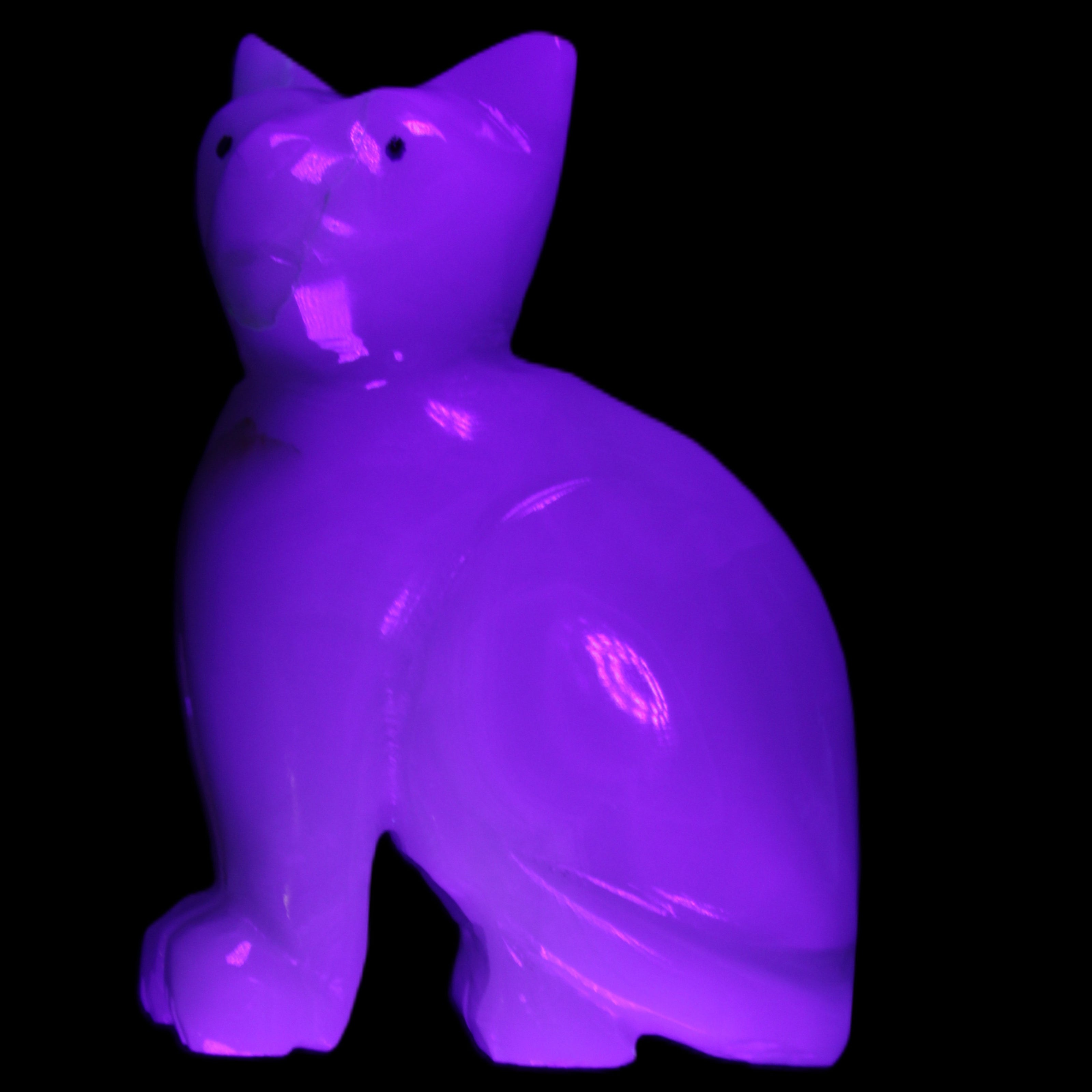 Afghan Jade hand-carved Cat 70*34*102mm 388g in UV light - Rocks and Things Store