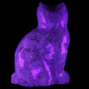 Fossil stone hand-carved Cat 81*45*115mm 534g in UV light - Rocks and Things Store