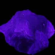 Clear Fluorite cubic cluster 82*58*60mm 404g in UV light - Rocks and Things Store