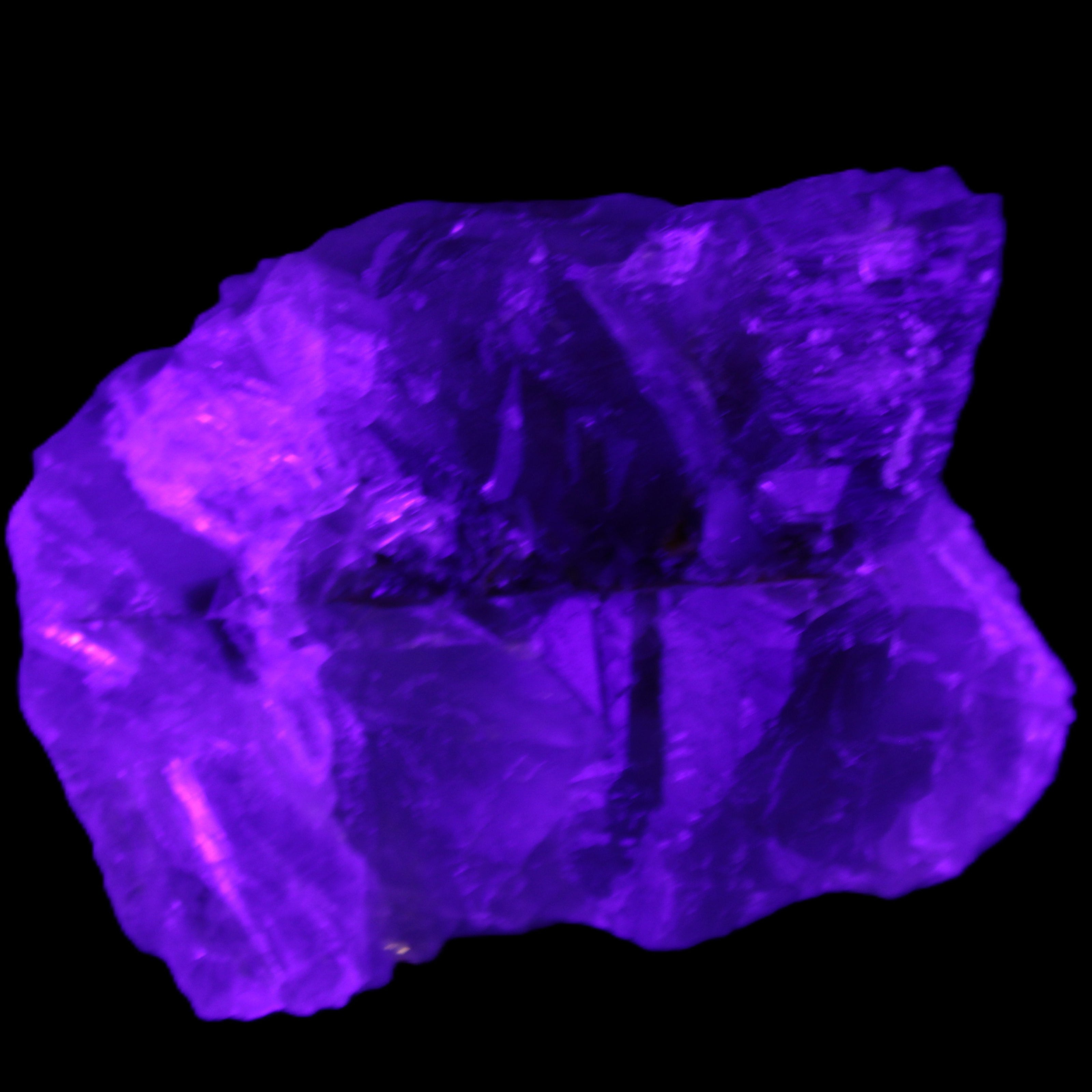 Clear Fluorite cubic cluster 82*58*60mm 404g in UV light - Rocks and Things Store