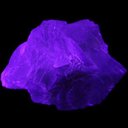 Clear Fluorite cubic cluster 82*58*60mm 404g in UV light - Rocks and Things Store