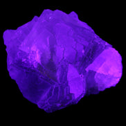 Clear Fluorite cubic cluster 82*58*60mm 404g in UV light - Rocks and Things Store