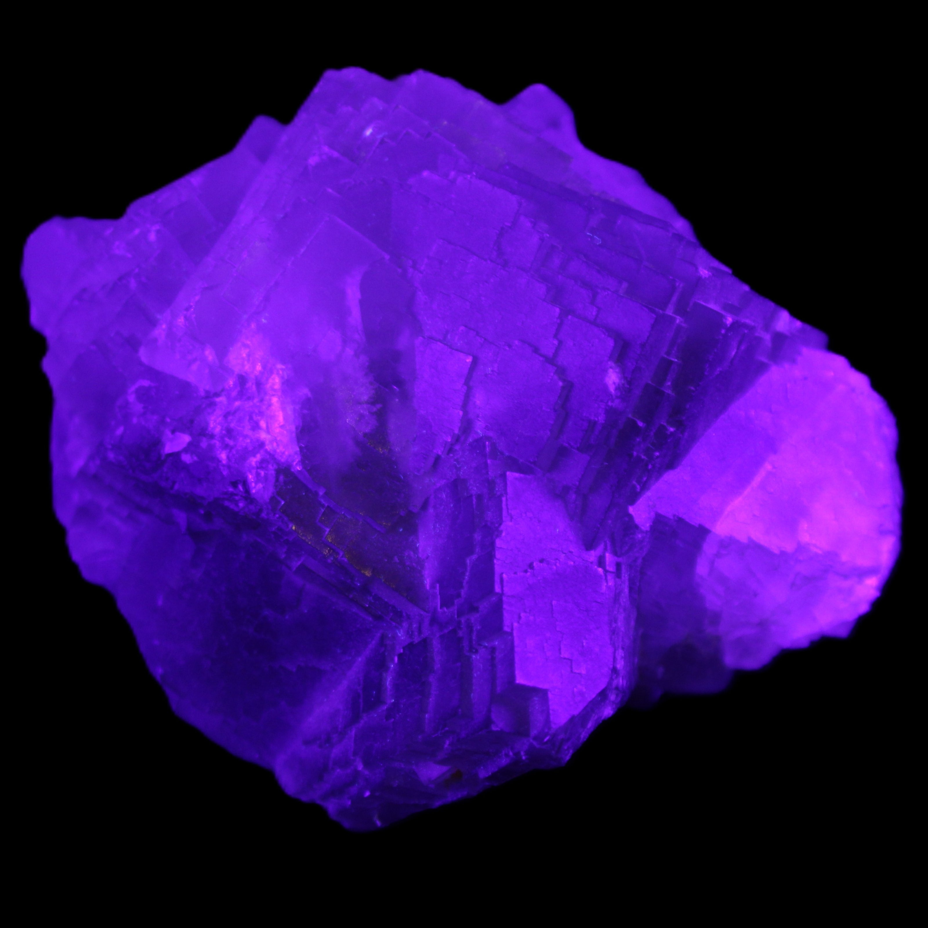 Clear Fluorite cubic cluster 82*58*60mm 404g in UV light - Rocks and Things Store