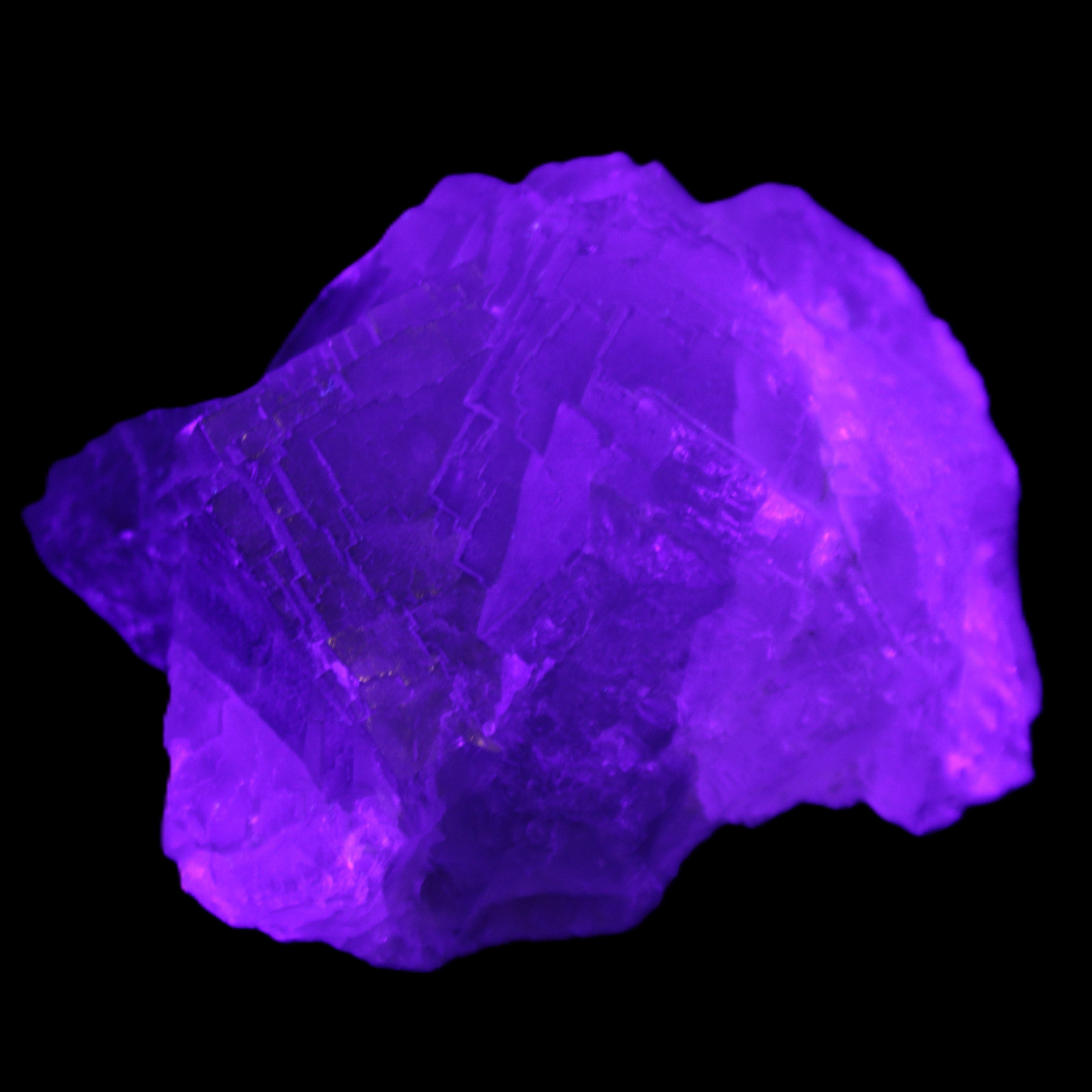Clear Fluorite cubic cluster 82*58*60mm 404g in UV light - Rocks and Things Store