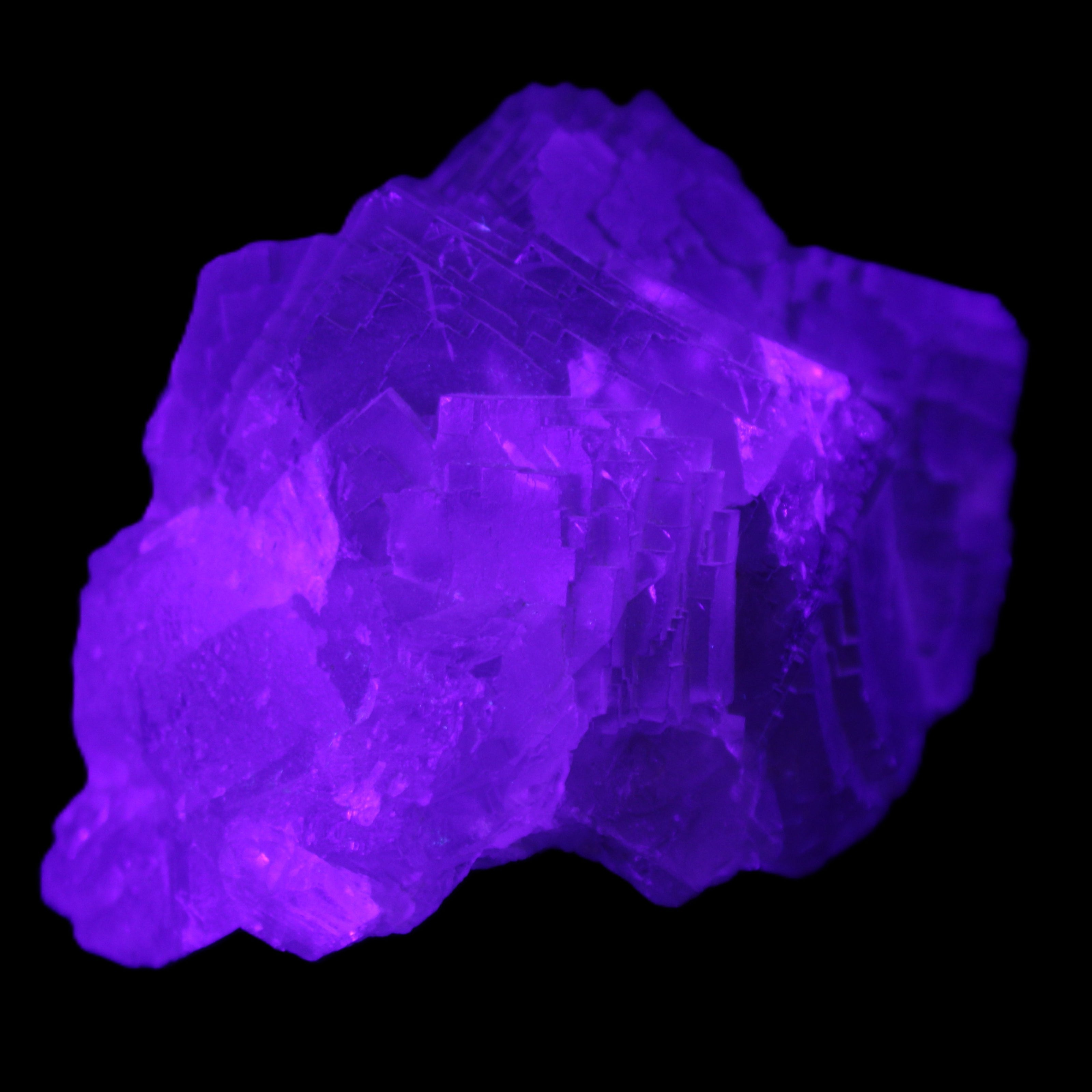 Clear Fluorite cubic cluster 82*58*60mm 404g in UV light - Rocks and Things Store