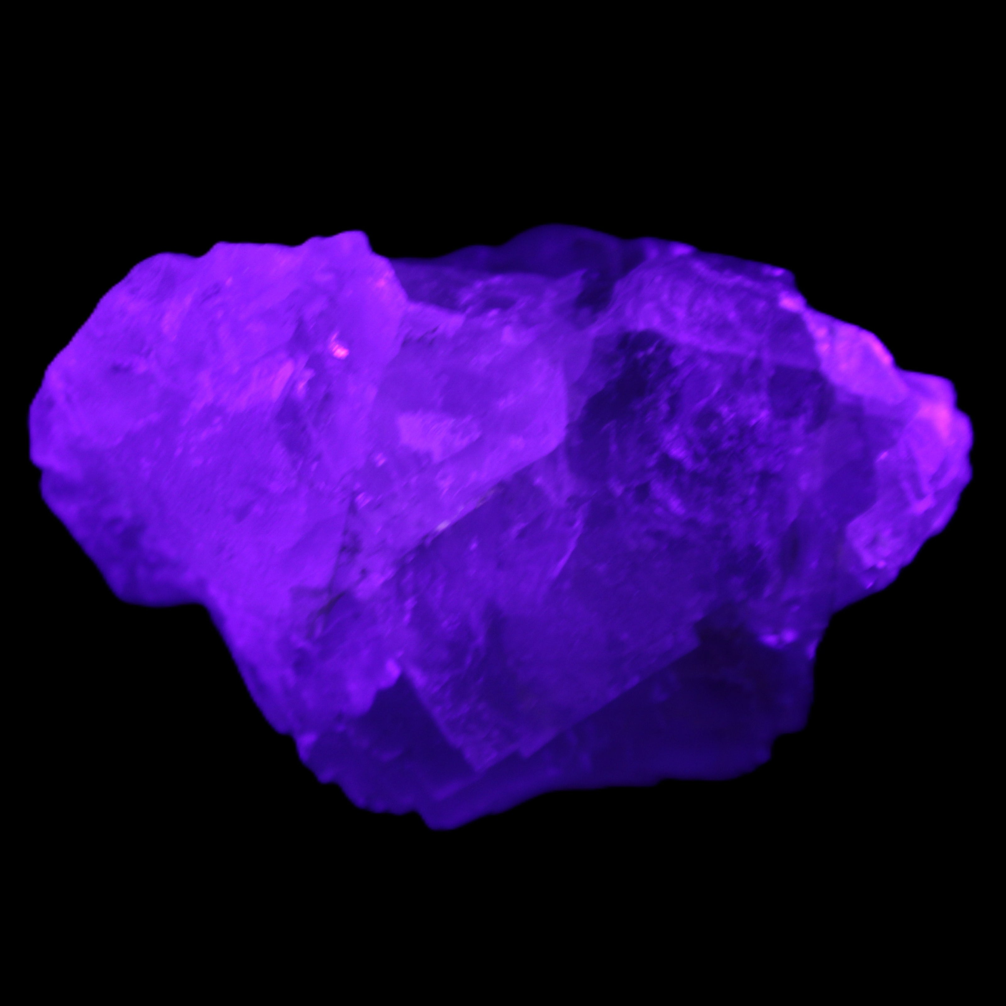 Clear Fluorite cubic cluster 82*58*60mm 404g in UV light - Rocks and Things Store