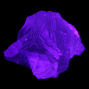 Clear Fluorite cubic cluster 82*58*60mm 404g in UV light - Rocks and Things Store