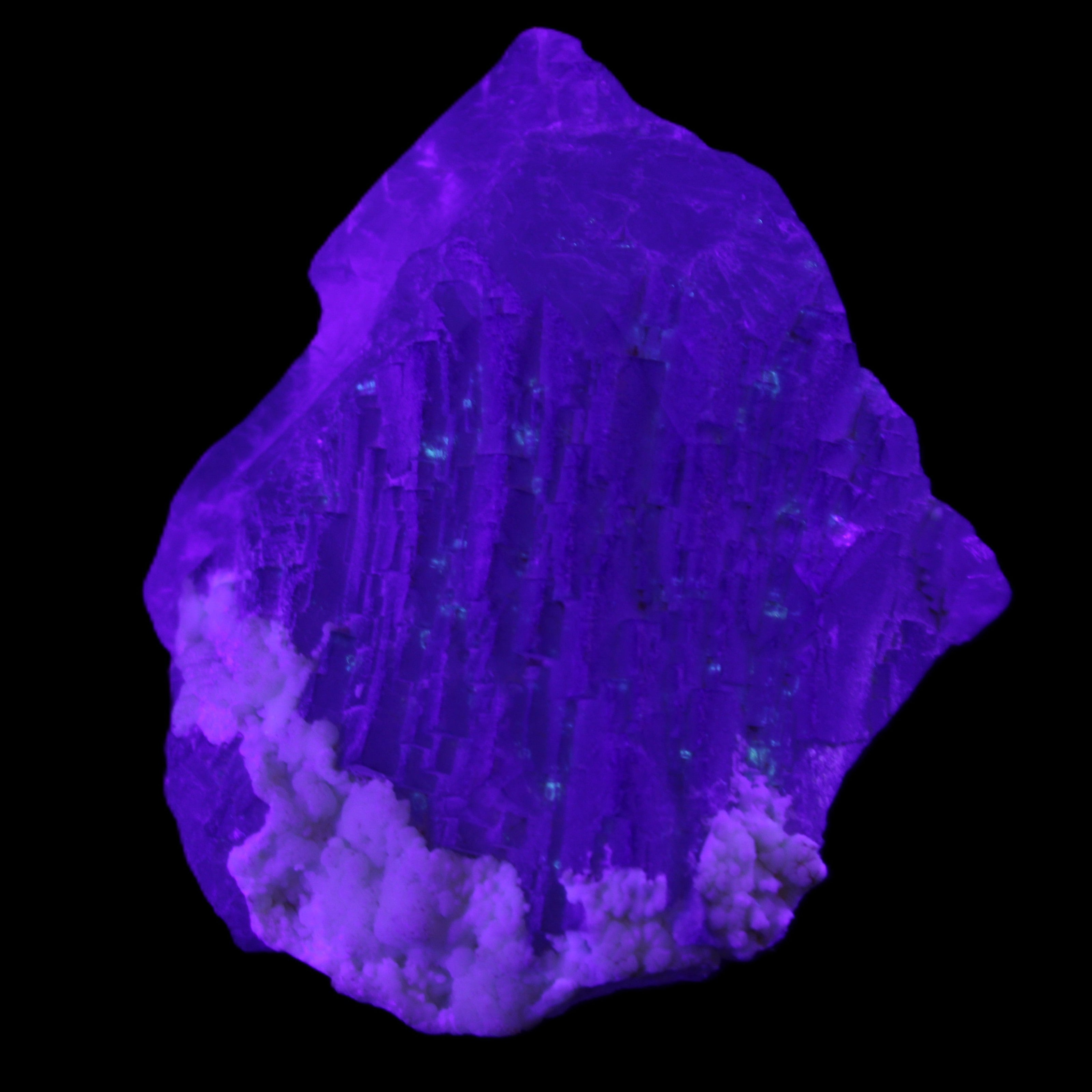 Clear with Violet tinged Fluorite cubic cluster 75*72*55mm 386g in UV light - Rocks and Things Store