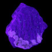 Clear with Violet tinged Fluorite cubic cluster 75*72*55mm 386g in UV light - Rocks and Things Store